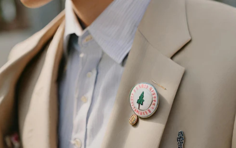 The jacket's material – wool or leather – impacts the type of pin that can be used and how they should be applied