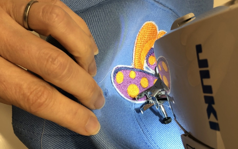 Begin sewing around the patch's perimeter