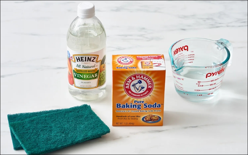 Natural solutions like white vinegar or baking soda can effectively remove adhesive residue without harsh chemicals