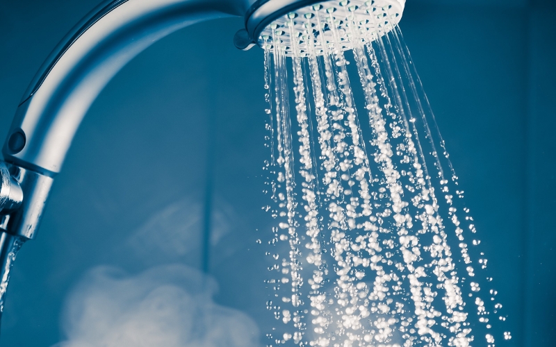 Hanging the garment in a humid bathroom during a hot shower