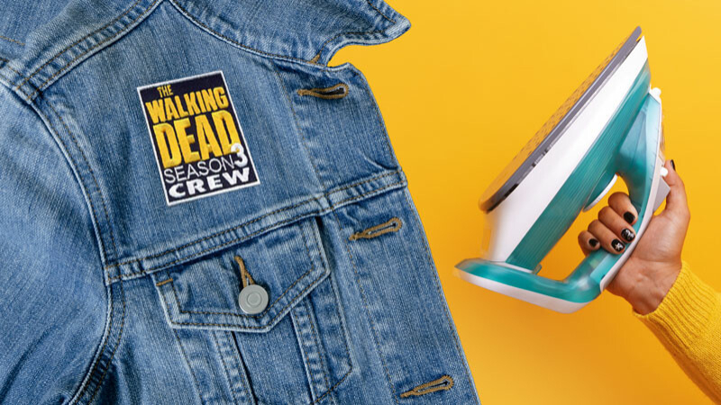 Iron-on patches use a heat-activated adhesive on their backing to bond with the backpack's fabric