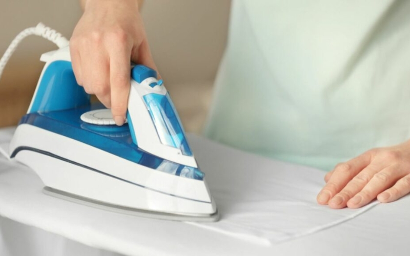 Placing a thin, absorbent cotton pressing cloth place over the nylon is essential